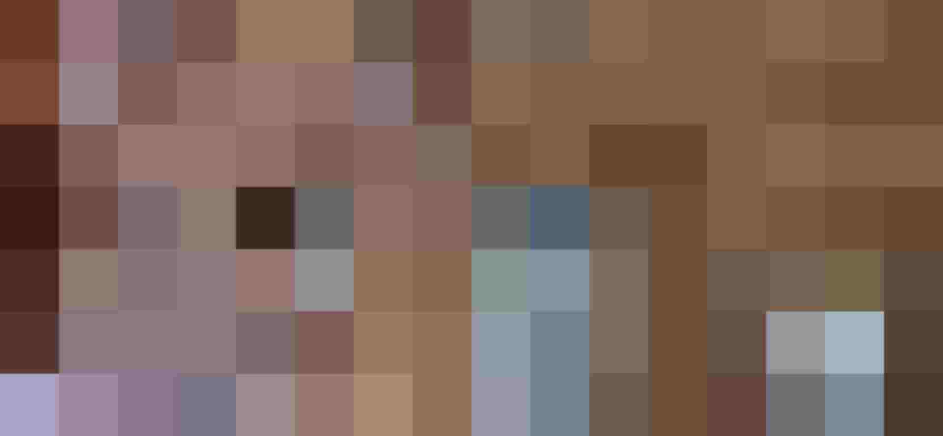 Historical photos in wooden frames on a rustic hotel wall in the design hotel DAS.GOLDBERG