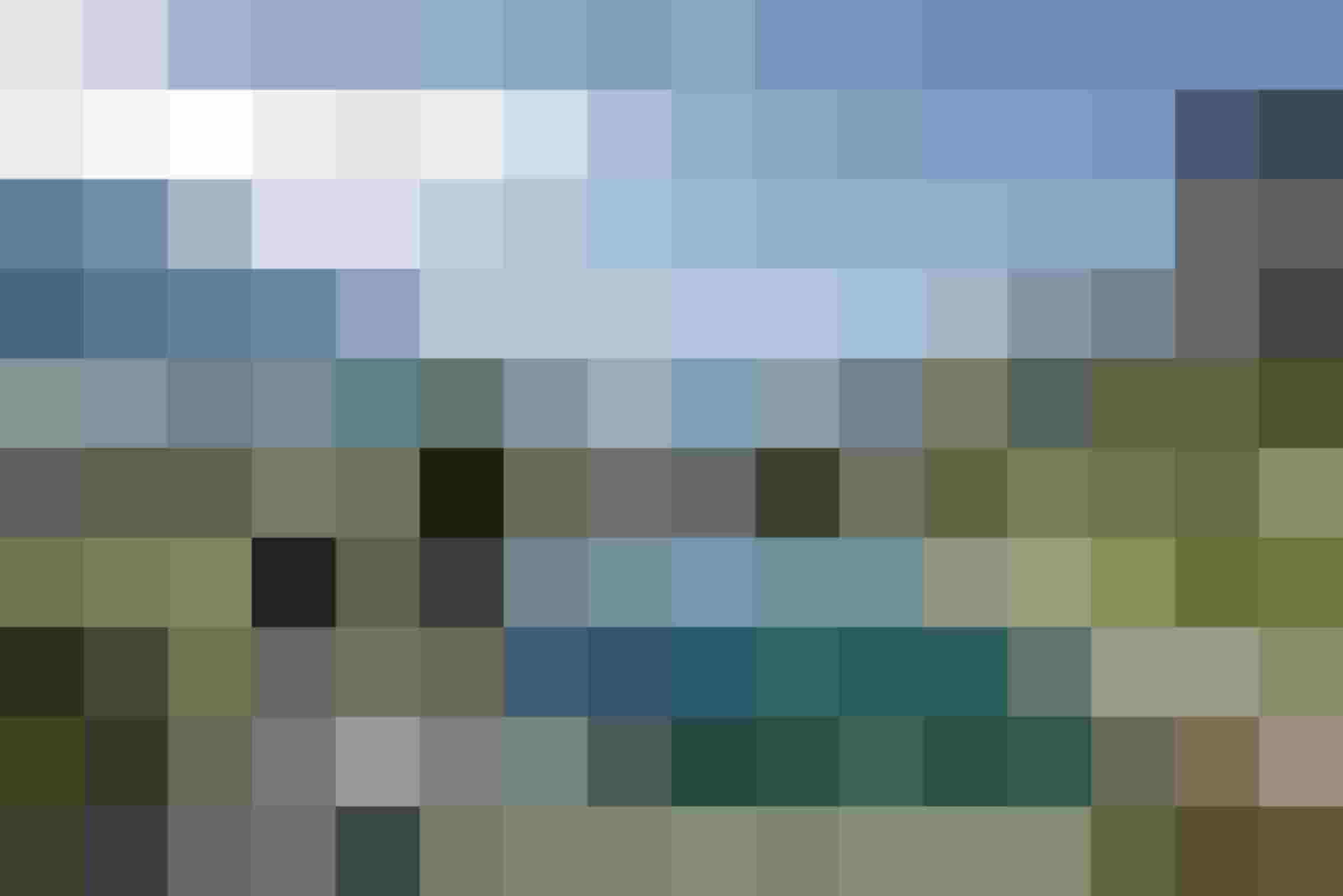 Blick von DAS.GOLDBERG auf Bad Hofgastein und den Naturbadeteich im Salzburger Land im Sommer