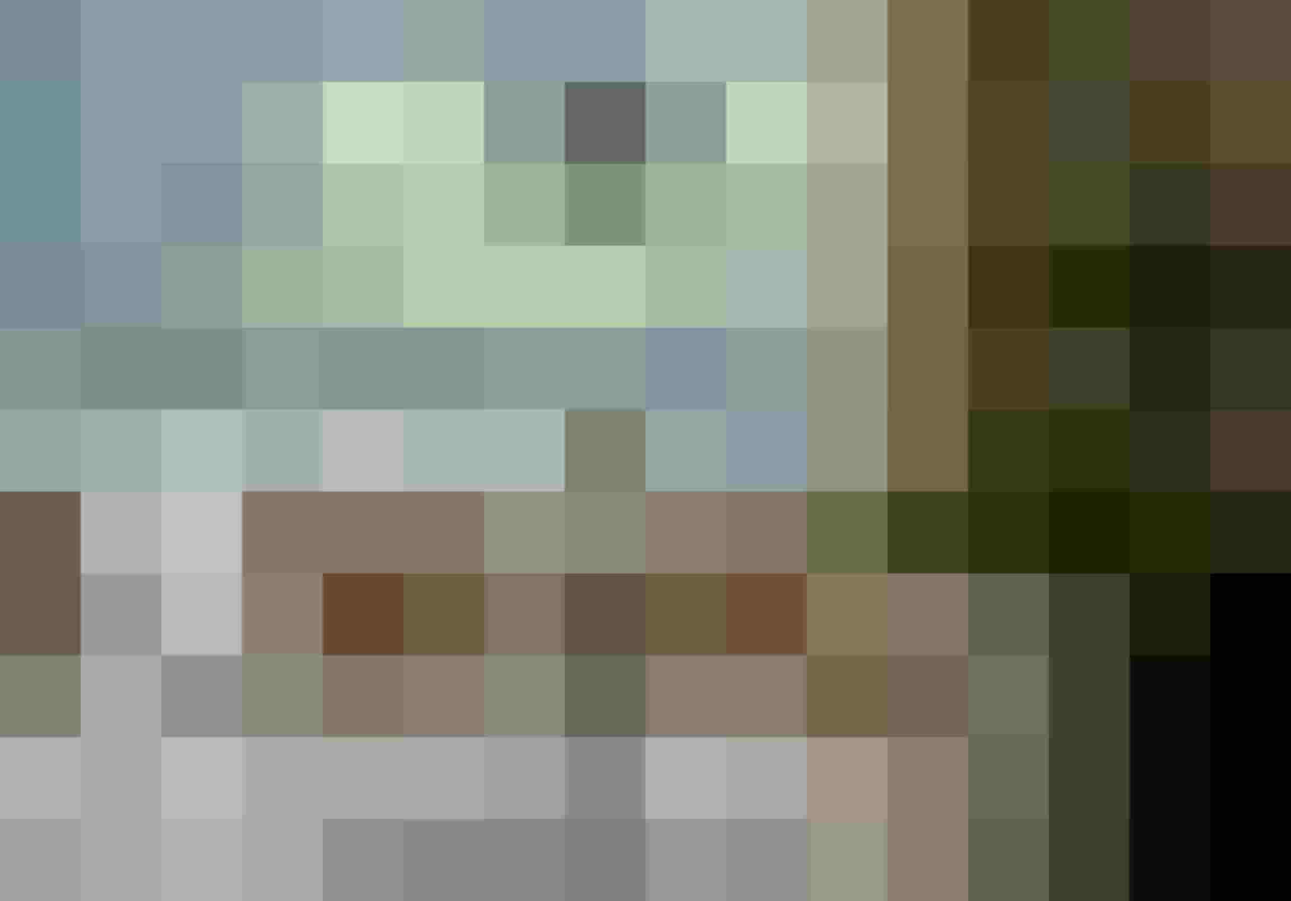 Elegante Sitzgruppe mit gedecktem Tisch vor Panoramafenster im Designhotel Salzburger Land