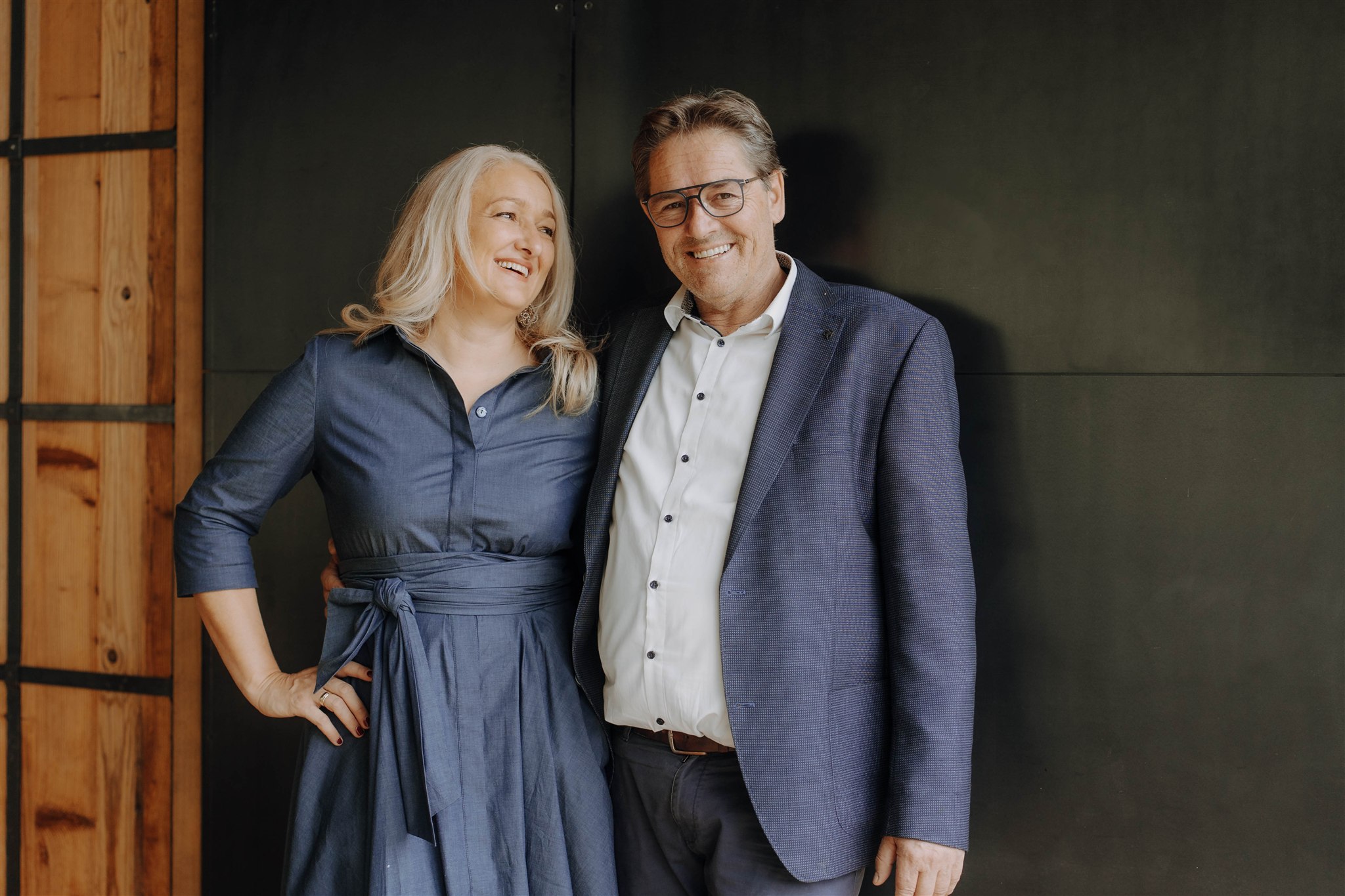 Two people standing next to each other, smiling